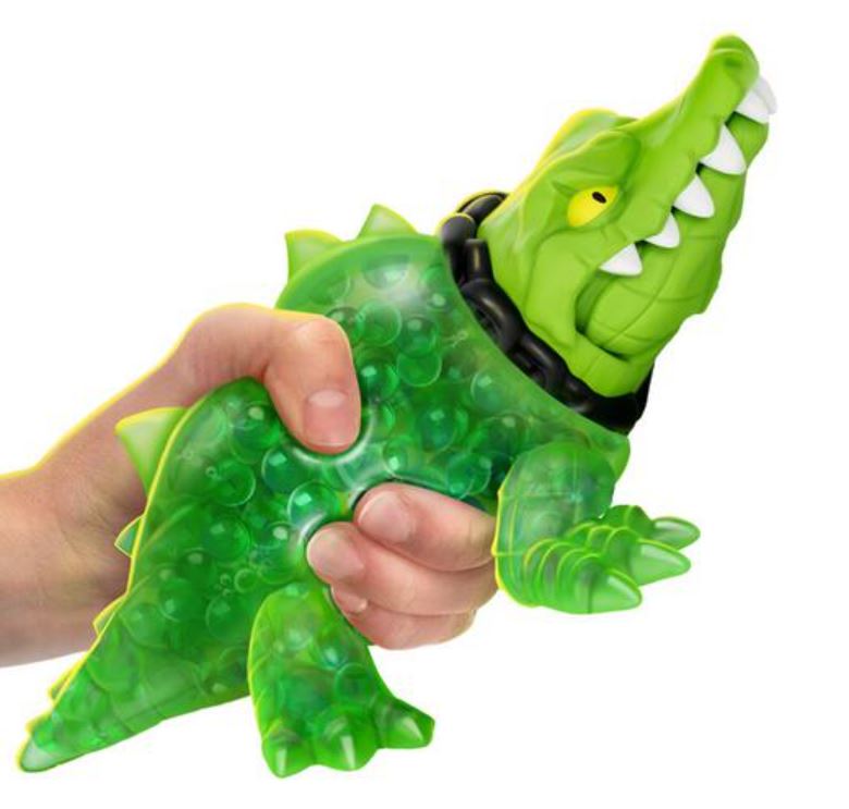 Un Crocodile Jouet En Plastique Vert Avec Un Grand œil Noir.